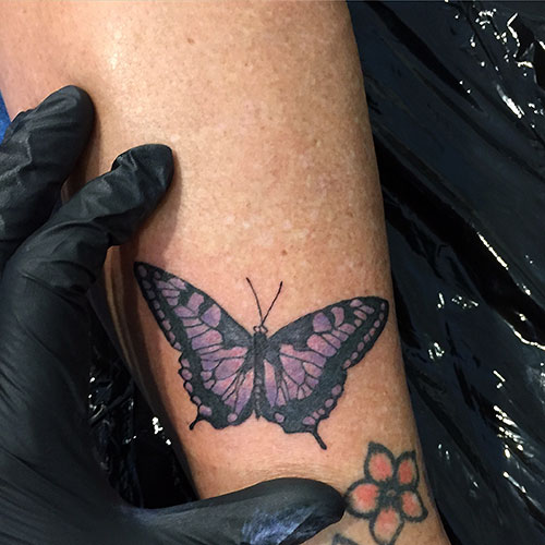 Lila Schmetterling Tattoo